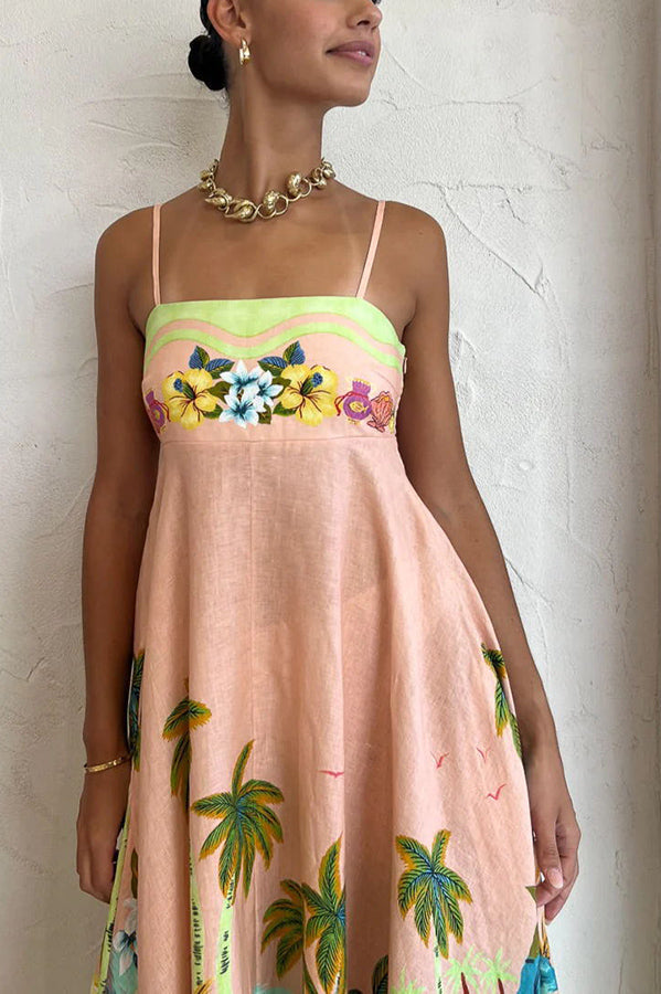 Vestido midi com estampa tropical e mistura de linho com cenário de coco