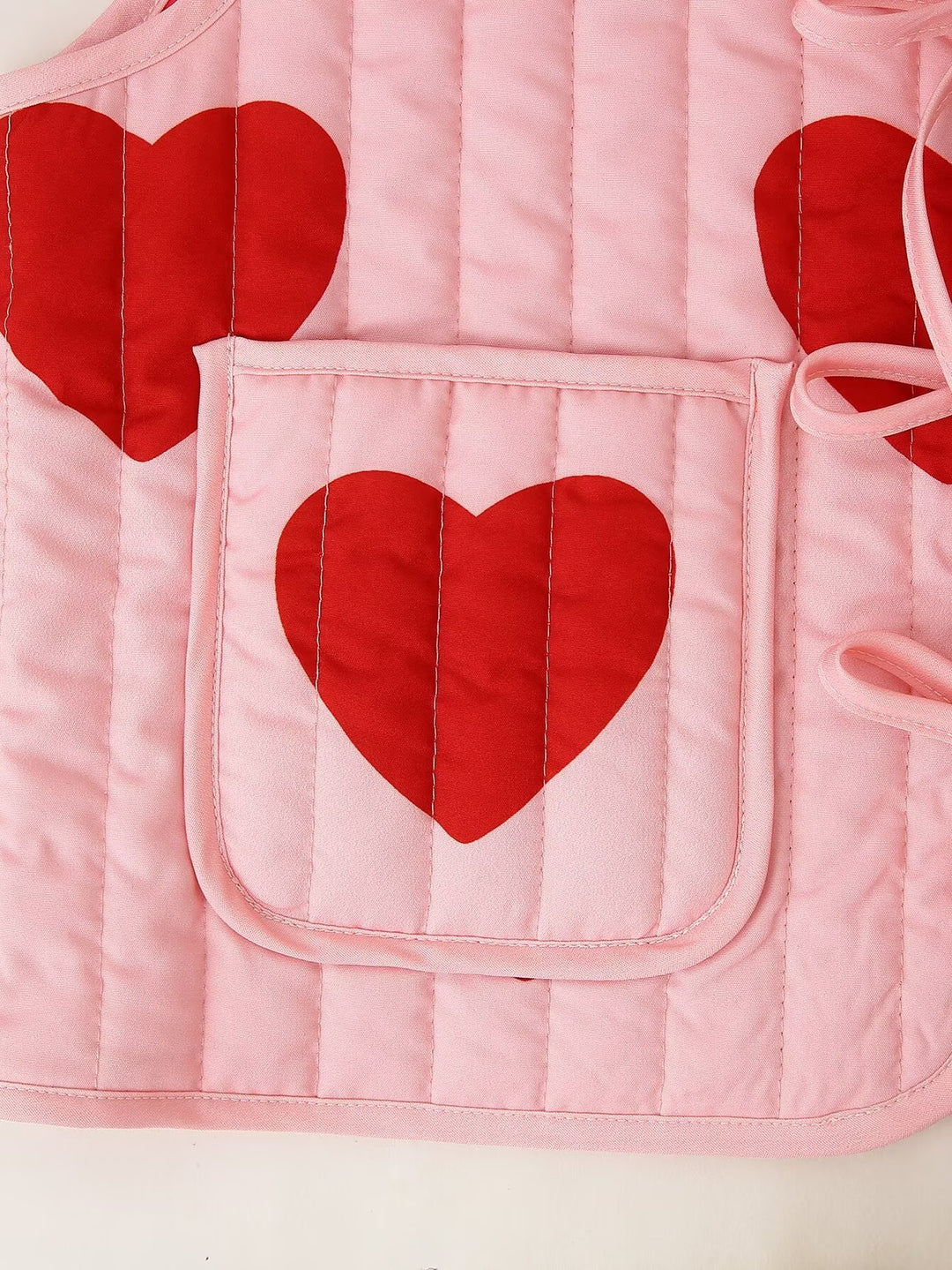 Gilet senza maniche con fiocco rosa e scollo a V con stampa a cuore